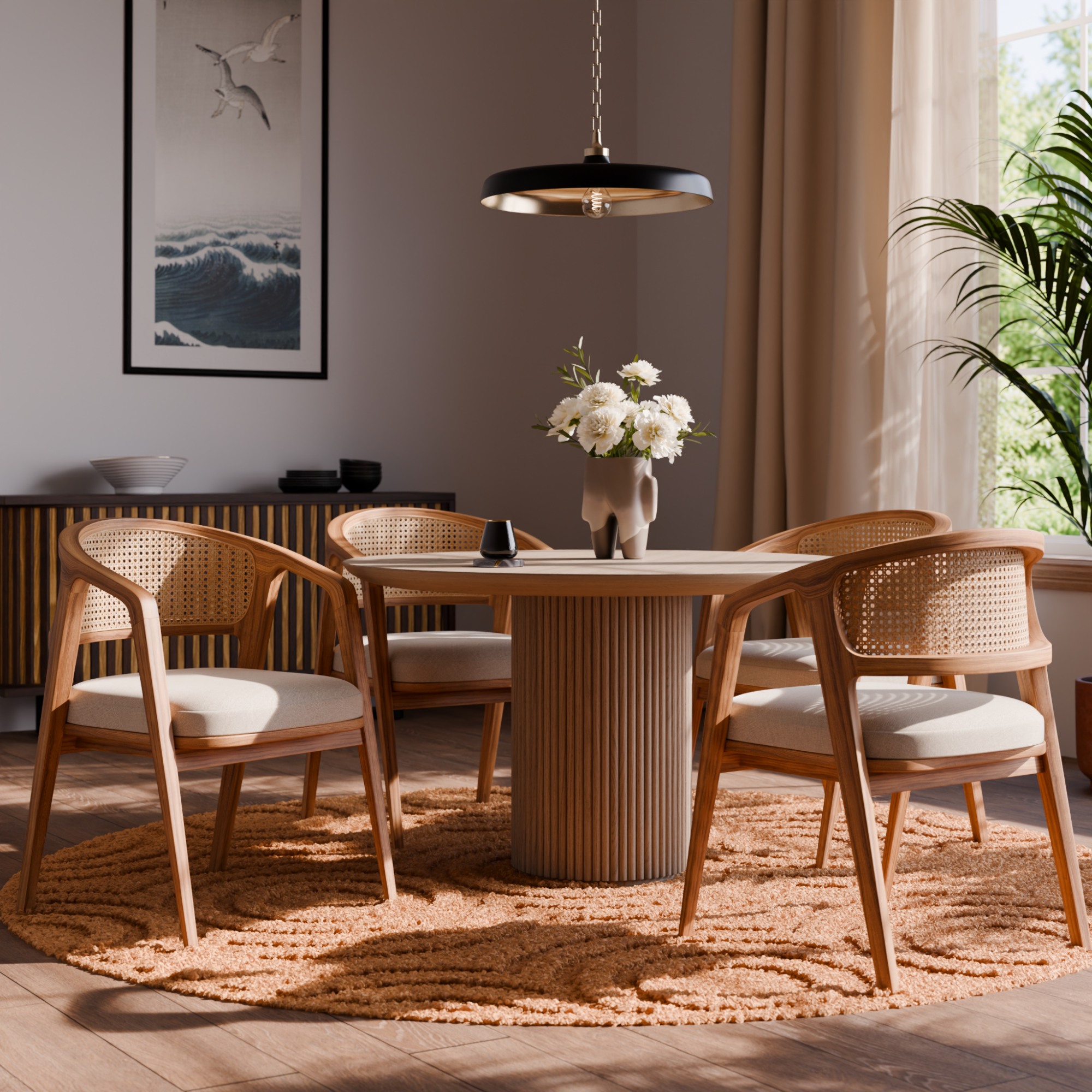 A sunlit dining room with woven chairs, a wooden table, and a hanging pendant.