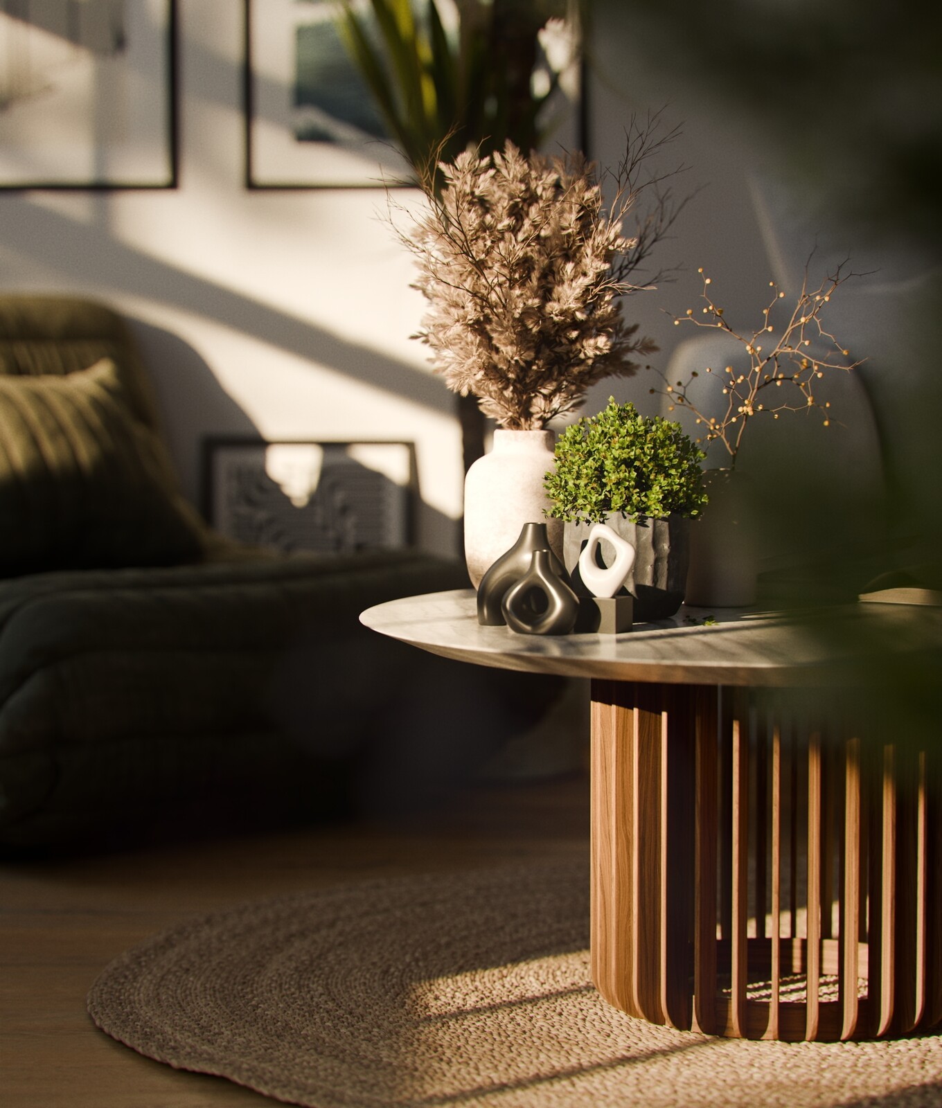 Stay: a sunlit living room with a sculptural table and floral arrangement.